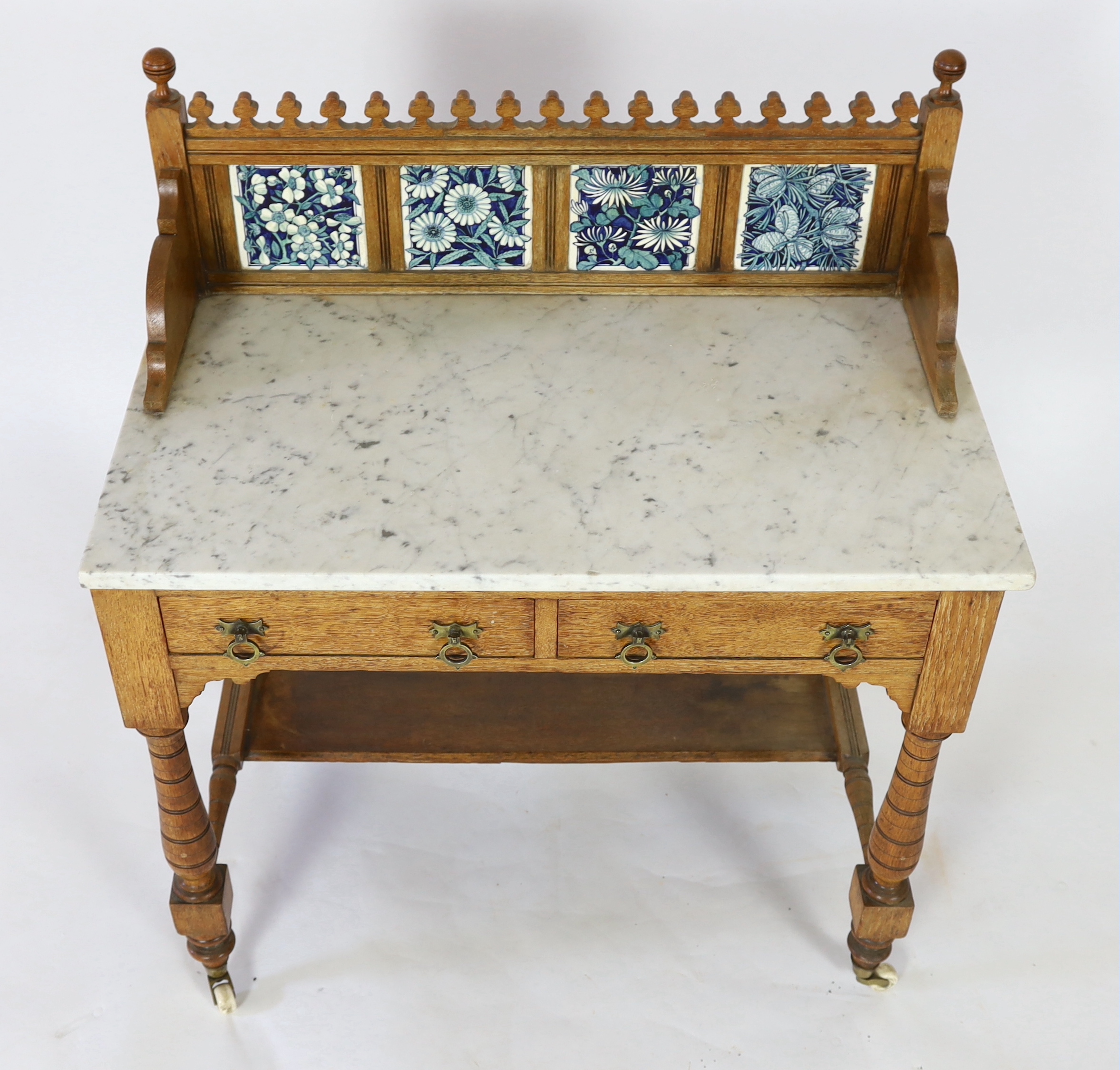 Lewis Foreman Day (1845-1910). A Victorian Aesthetic movement golden oak and marble washstand, width 90cm, depth 51.5cm, height 104cm